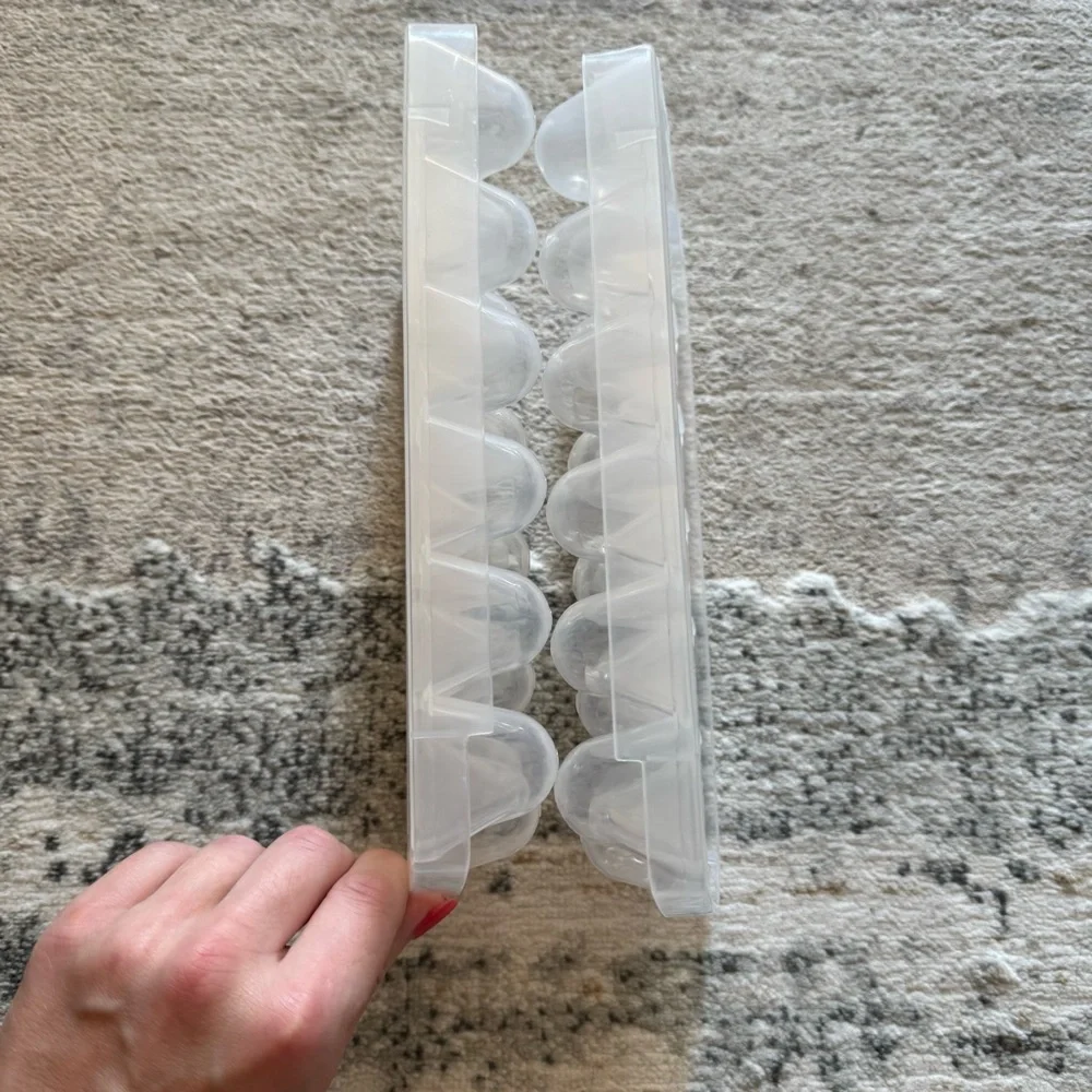 Bundle of 2 ice cube trays and plastic storage bin